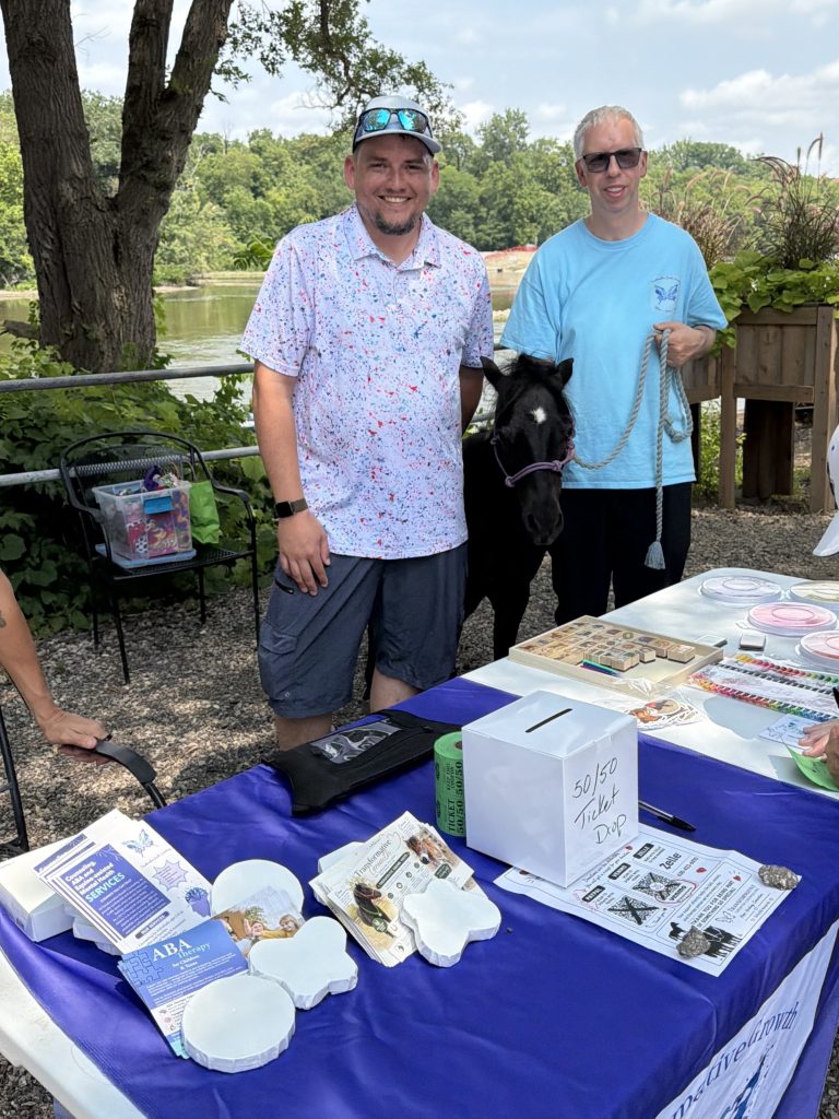 The Transformative Growth Counseling information table at a community event